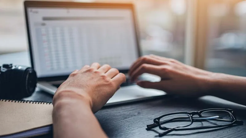 Owner reviewing a declining spreadsheet that shows the business loss