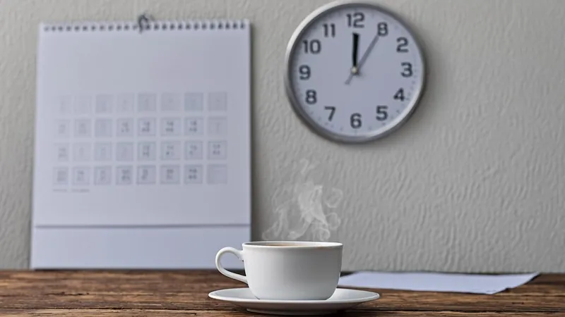 Wall calendar with clock and coffee cup marking upcoming tax planning dates
